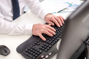 Hands typing on a keyboard